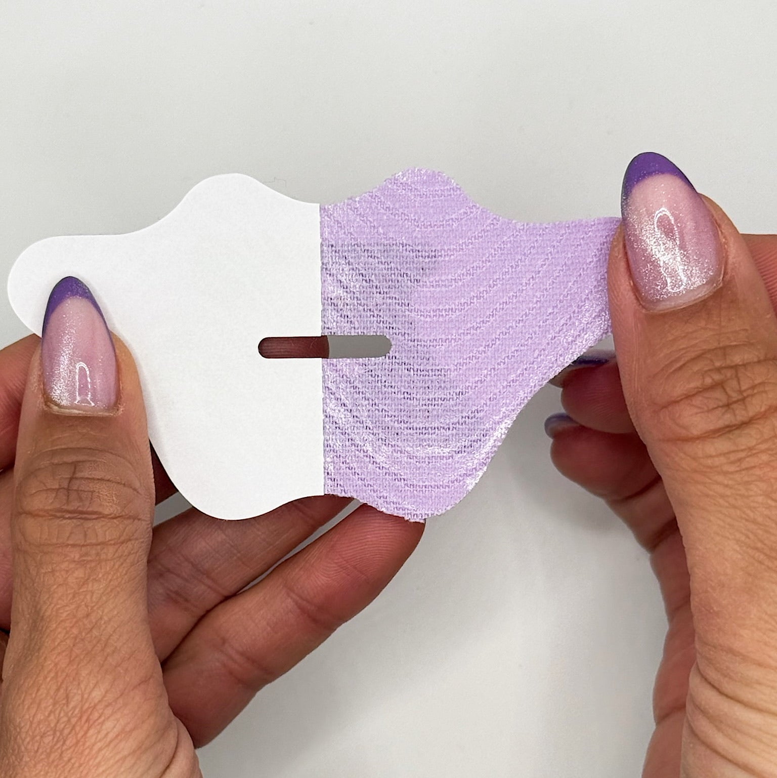 Applying Bedrock lilac mouth tape for deep sleep, better energy, and natural breathing benefits.