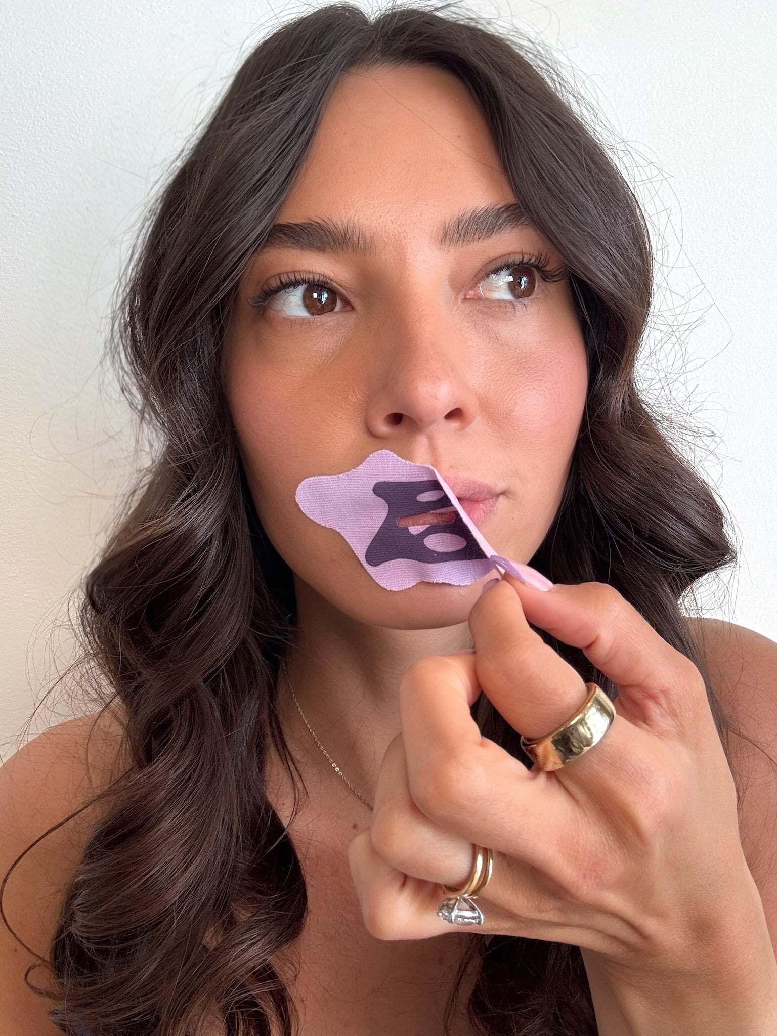 Removing Bedrock lilac mouth tape with premium silk material for deep sleep, natural breathing, and better energy.